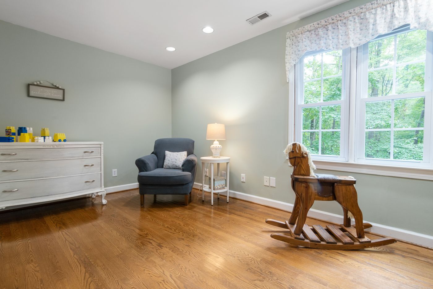 A warm oak floor in an upstairs bedroom of an older Wolseley house.